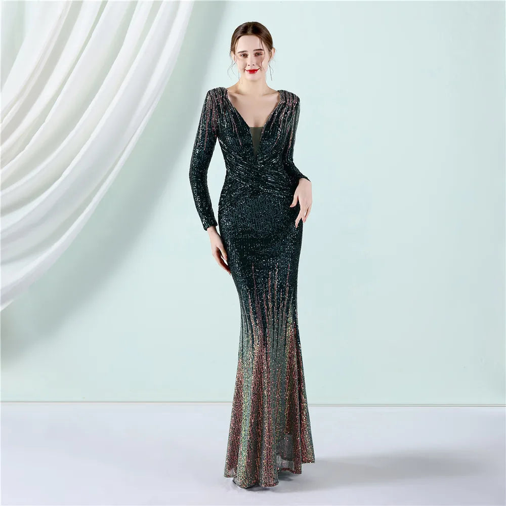 Woman wearing a long, glittery evening gown against a white curtain background