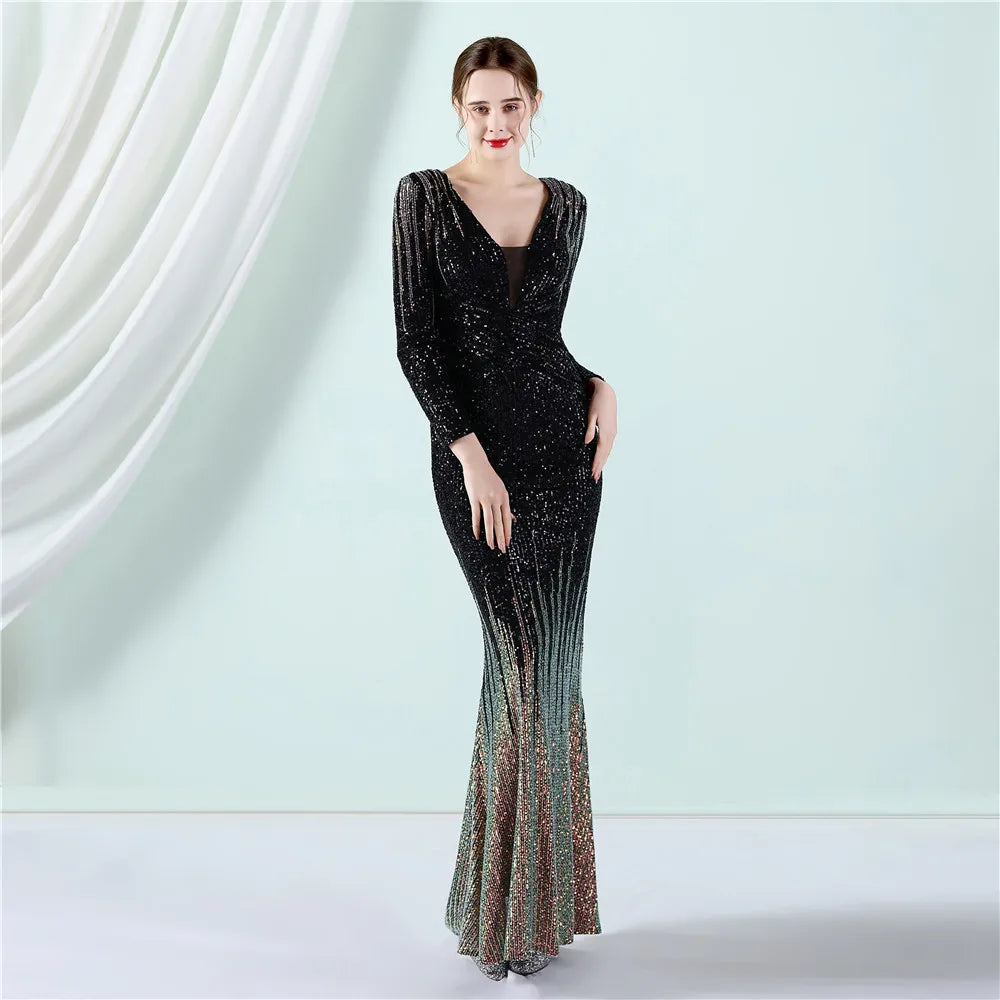 Woman wearing a black sequin evening gown against a light green curtain background